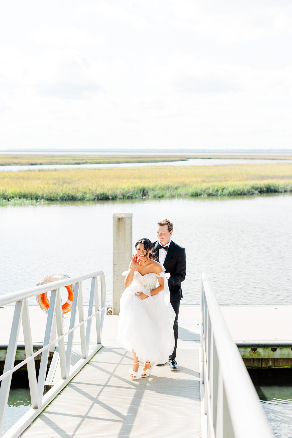 Bride and groom on dock at walkers landing