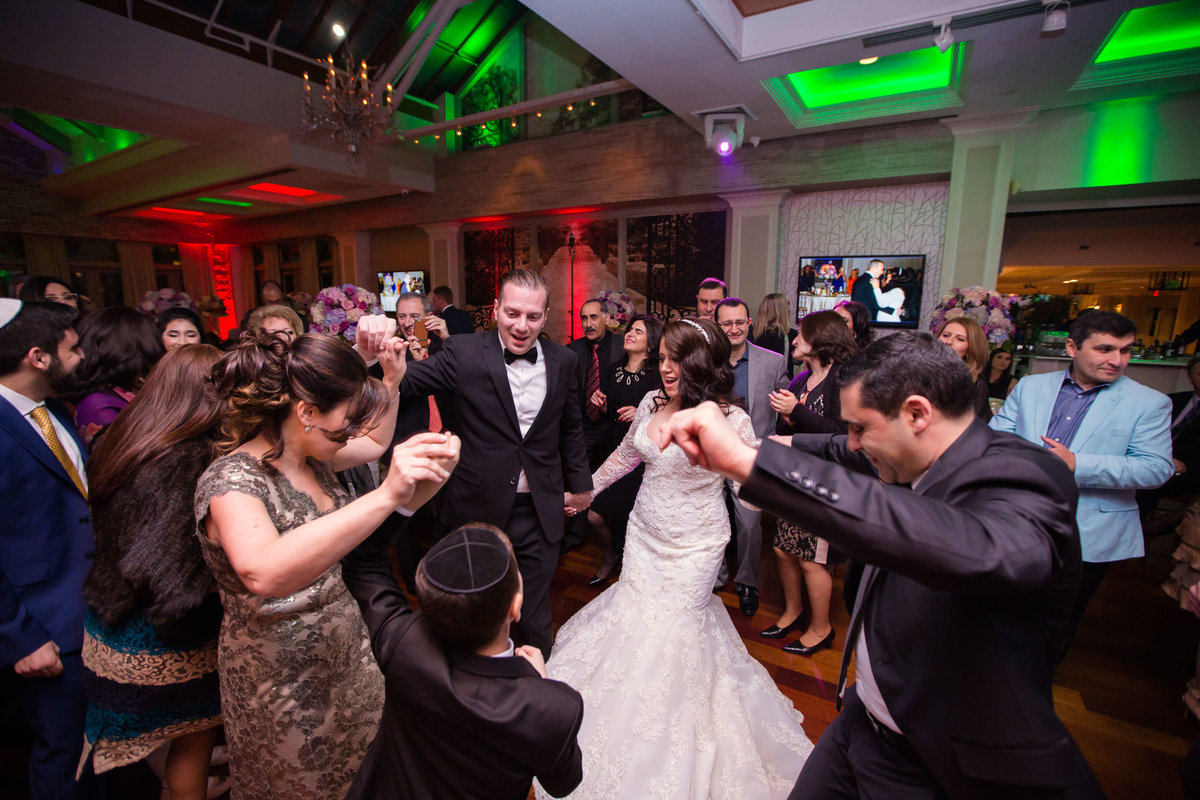 Bride and groom dancing with guests at The Somerley