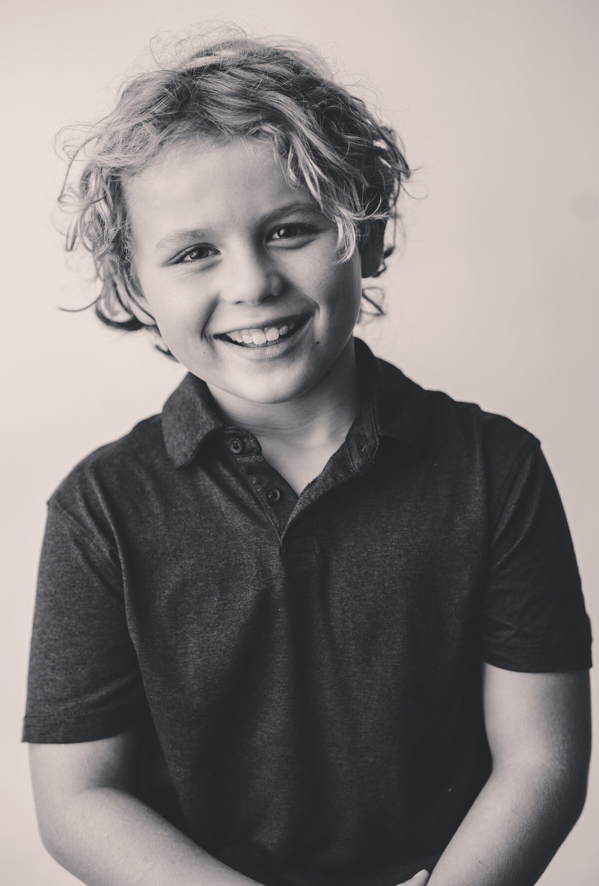 Young boy poses for Personality Portraits in Charleston, South Carolina.