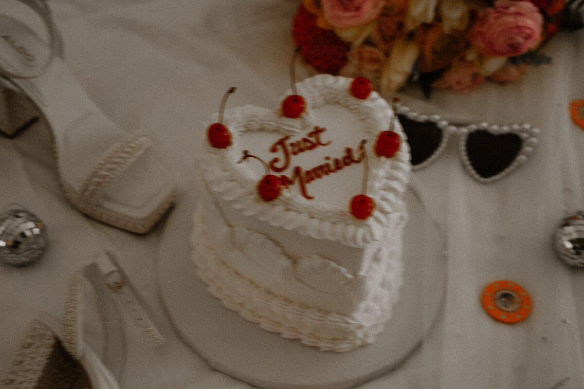 flat lay of a just married cake for a bride and groom in las vegas getting married