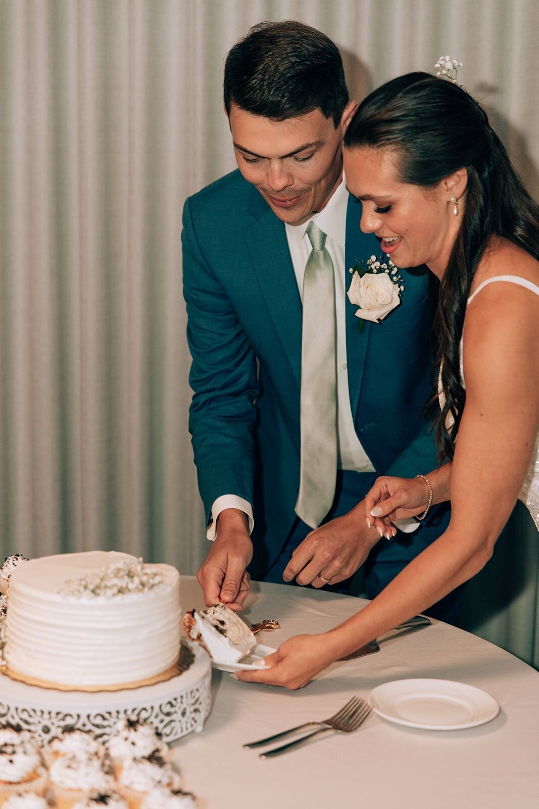 bride and groom cut their wedding cake