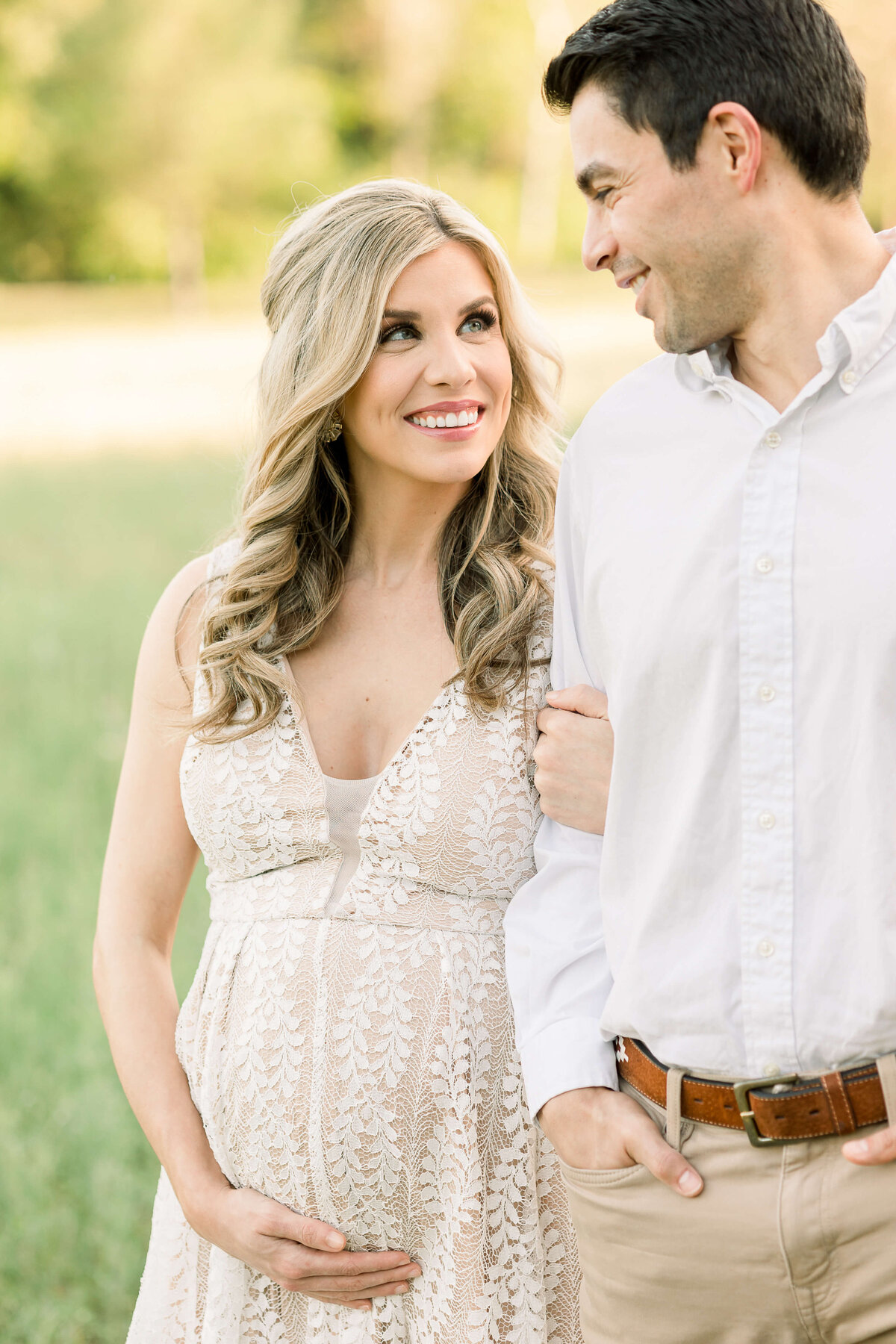 close up of a pregnant woman lovingly looking at her husband