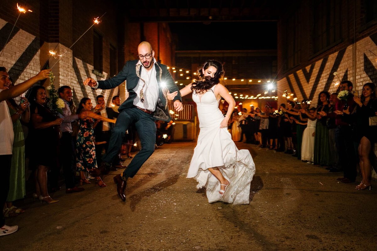 bride and groom exiting at epic railyard venue In el paso texas