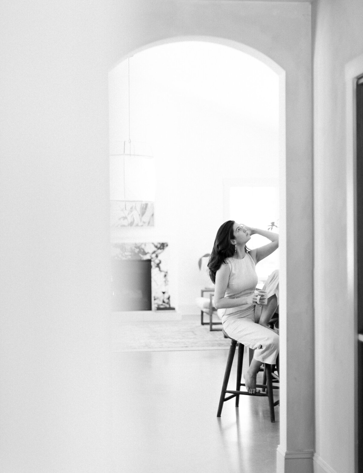 relaxed designer gazes upward at Fernhaus, film brand photos for Lagom Creative, Michigan designer