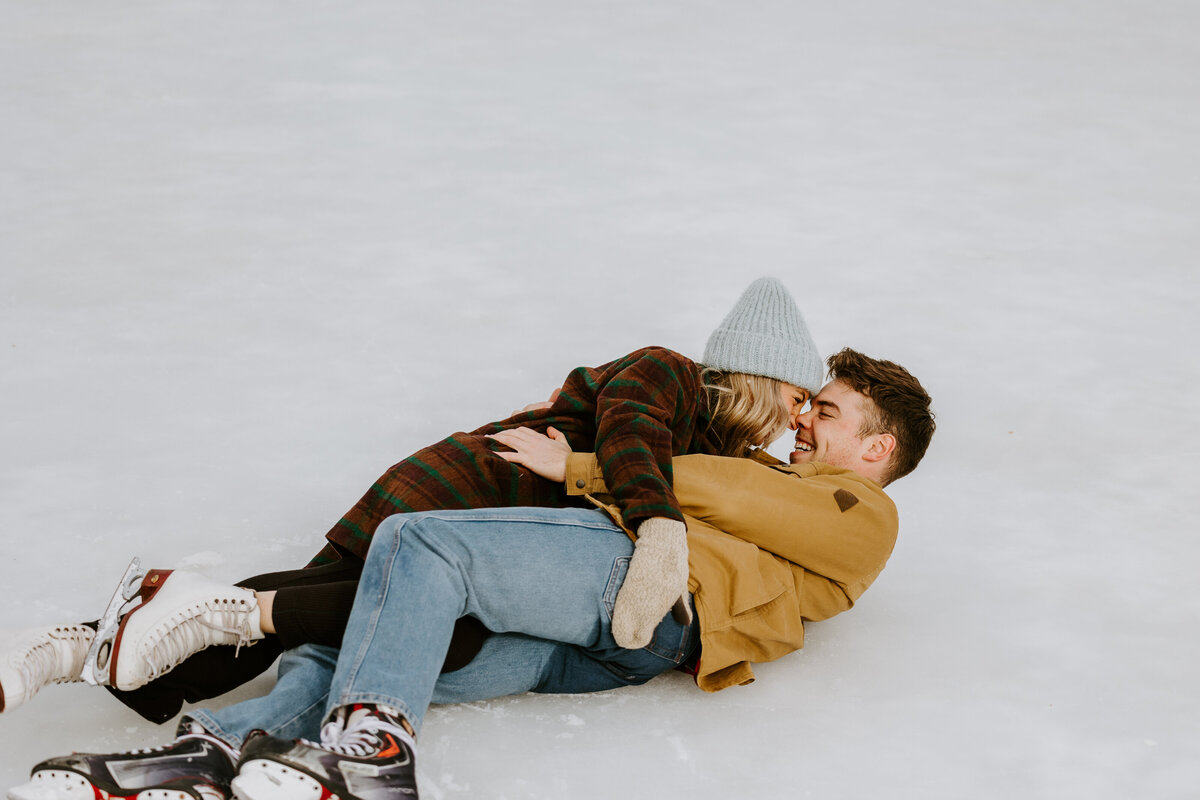 Couple cuddles during a winter photo session.