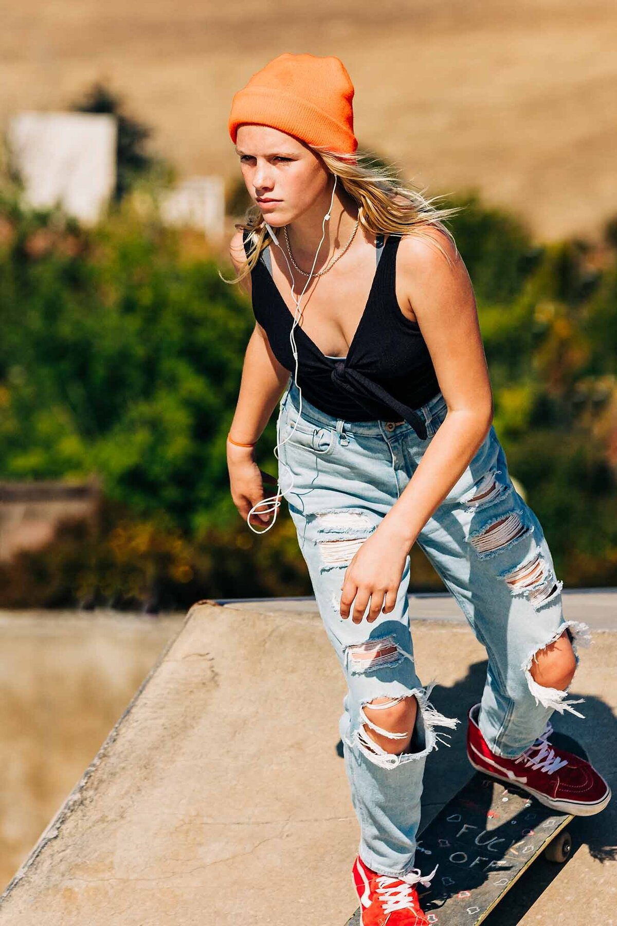 Skater girl with orange beanie at Mobash Skate Park in Missoula, MT