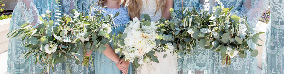 bride and bridesmaid bouquets lined up . wedding photography by Jessica Bowles