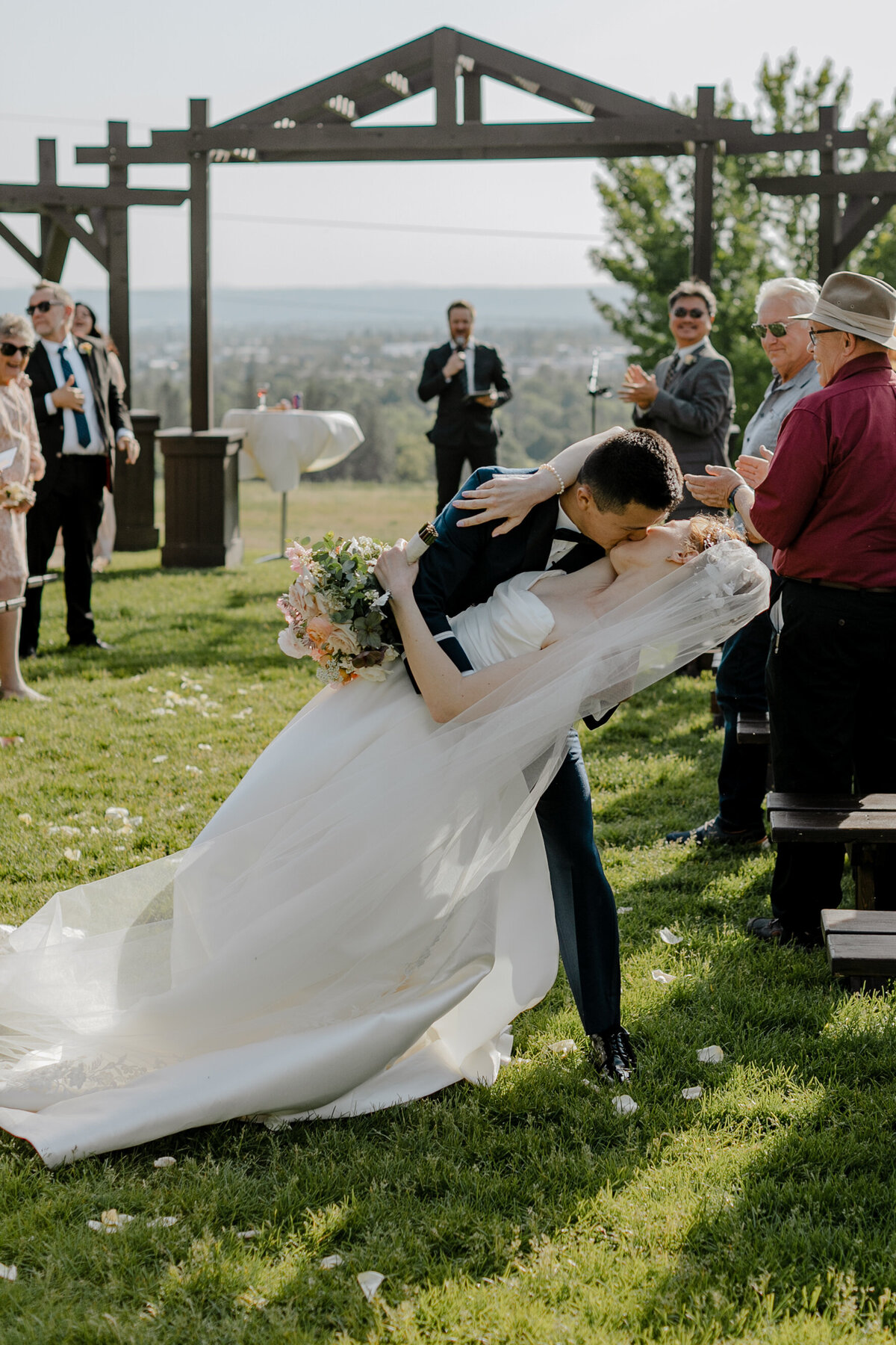 bride and groom kissing after ceremony