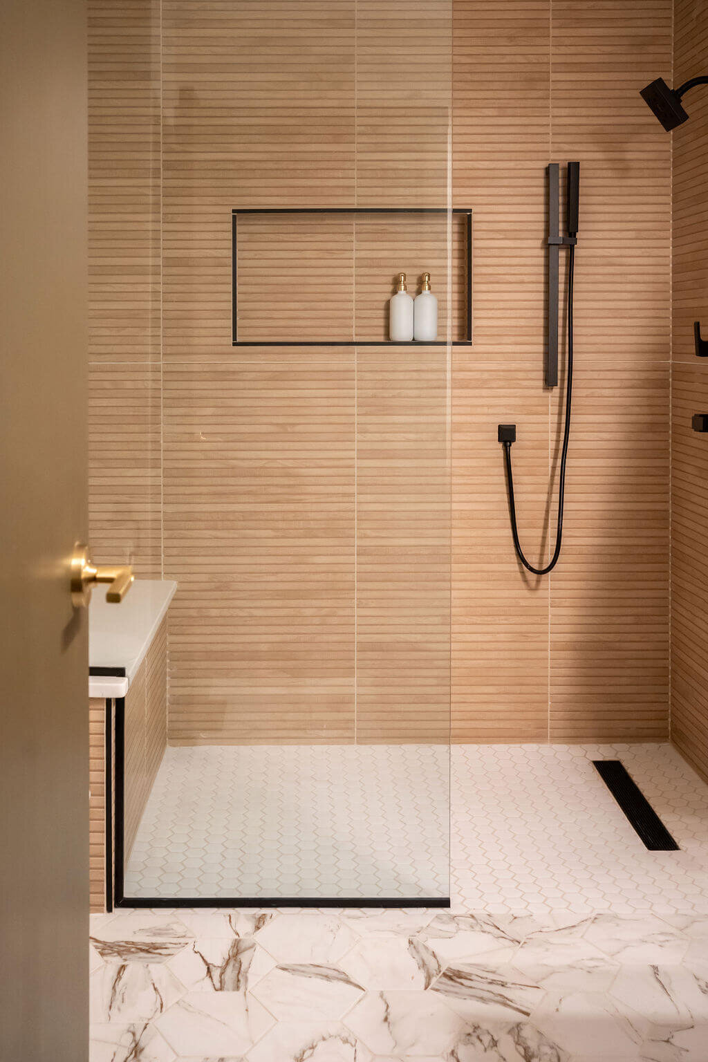 sweet southern home mid mod tan tiled shower in bathroom