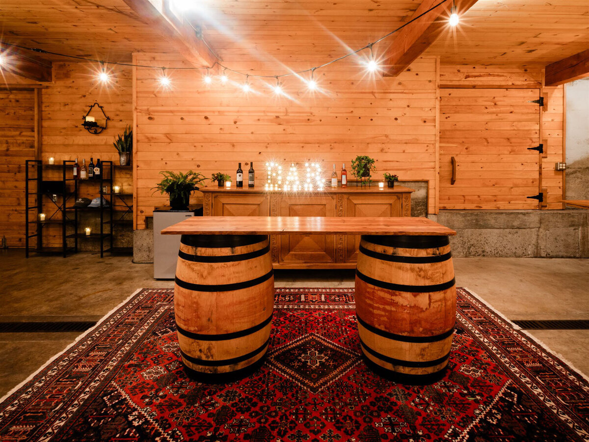 The Barrel room at Chateau Lill full of wine barrels