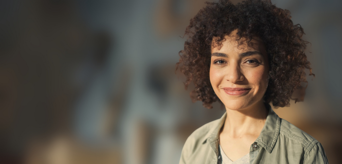 A smiling, confident woman of color non profit leader.