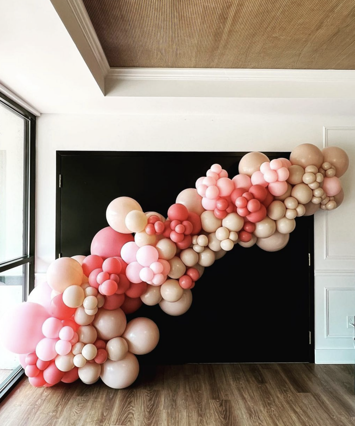 Bright pink and gold balloon garland perfect for celebrations or corporate events.