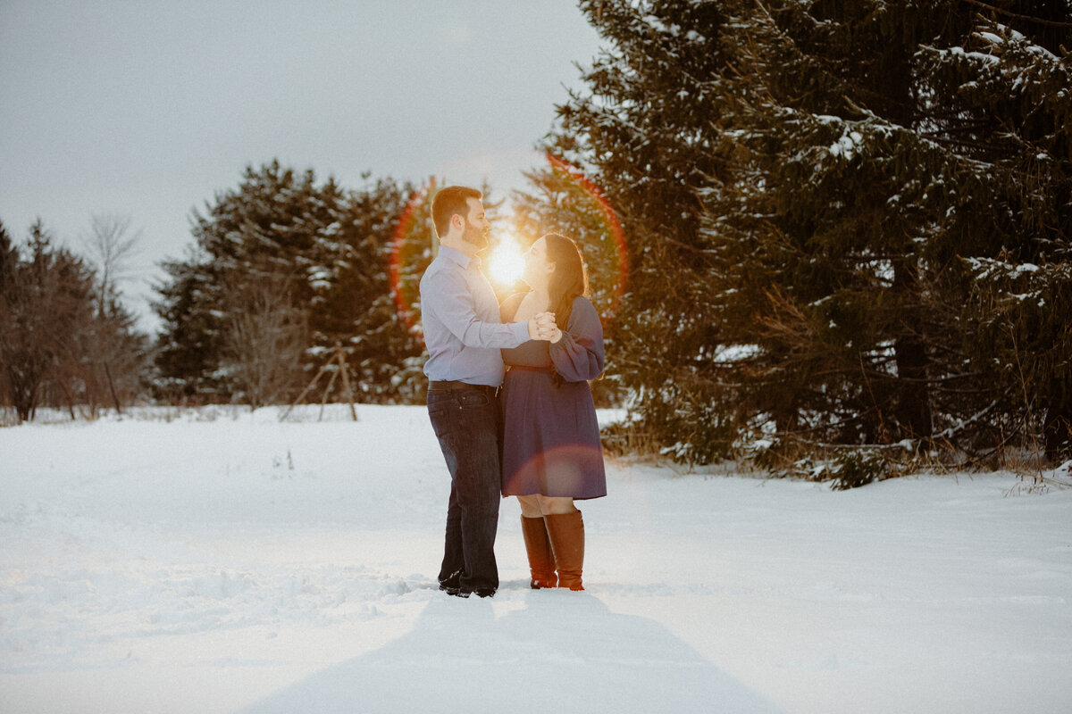 engaged-couple-embracing-in-the-snow-in-north-dundas-ottawa-1