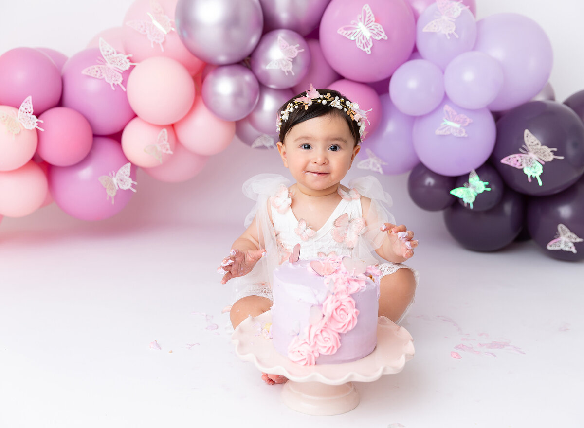 baby girl at her first birthday cake smash session in Brooklyn NYC done by Rochel Konik Photography