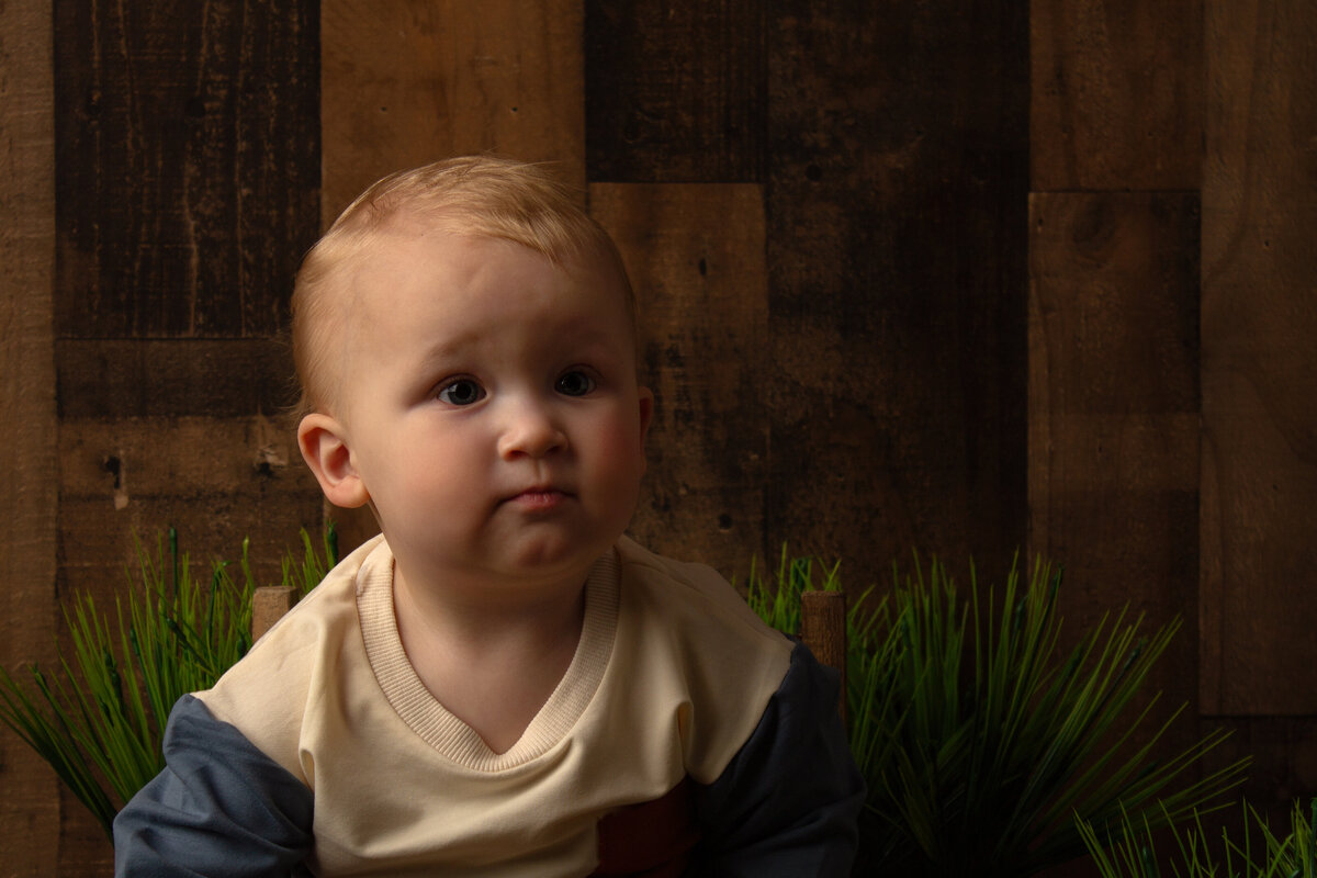 Minot AFB milestone session with a little boy looking away.