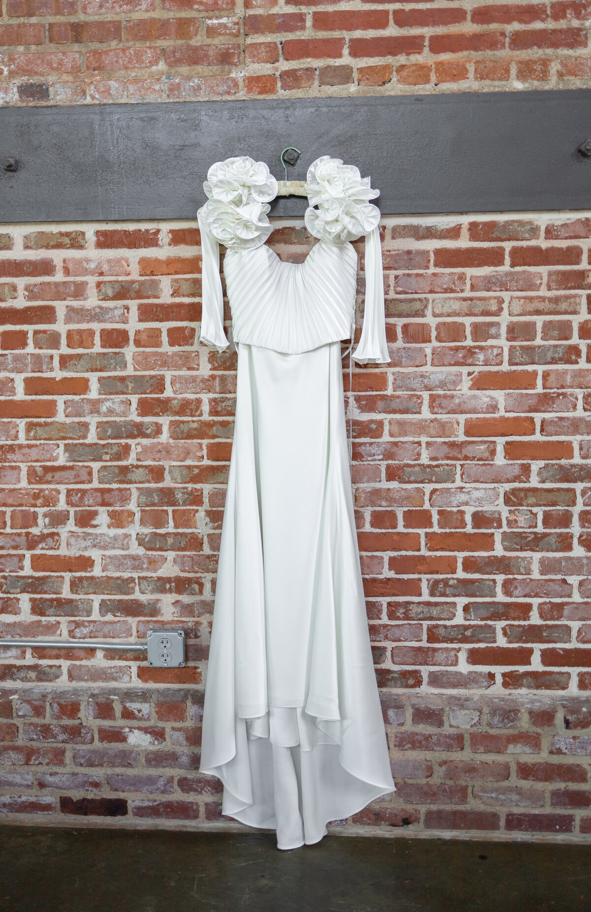 wedding dress hanging up at The Powerhouse in Columbus Georgia by Columbus Georgia wedding photographer Amanda Richardson Photography