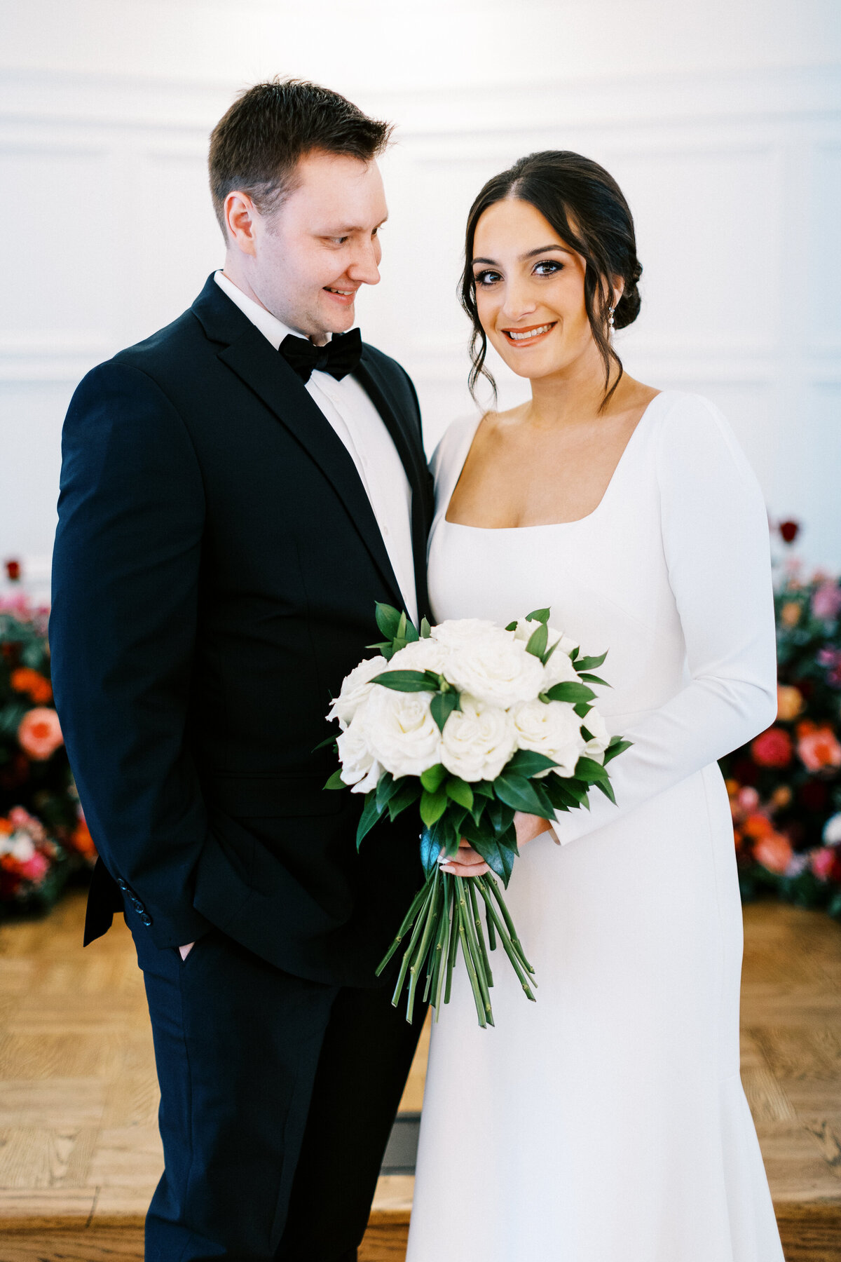 Groom is looking at the bride with happiness