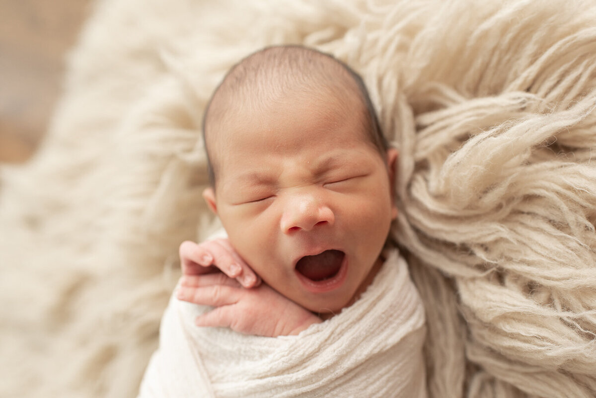 Newborn boy yawning at rustic newborn session | Sharon Leger Photography | CT Newborn & Family Photographer | Canton, Connecticut