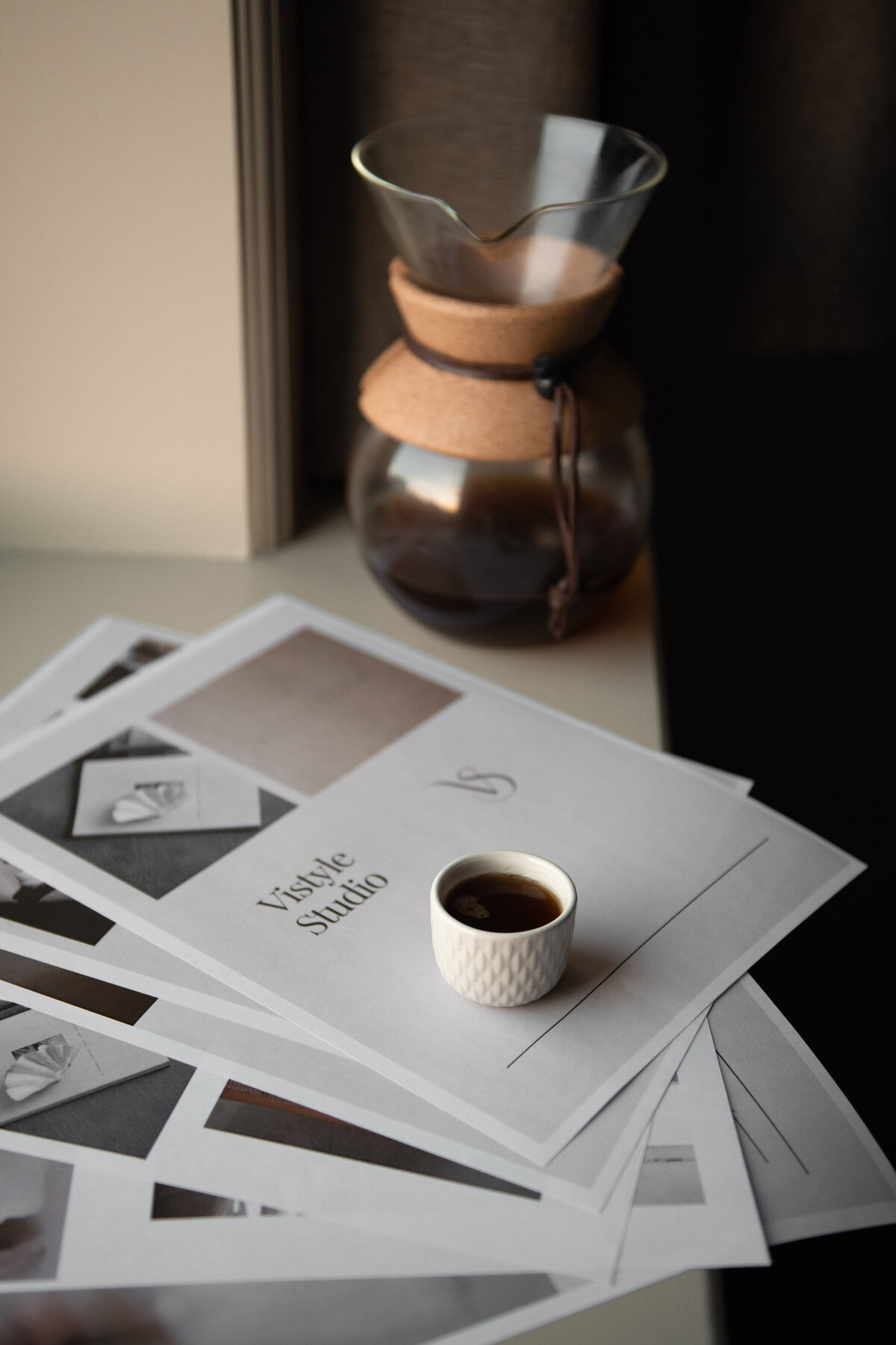 Social Media photoshoot for creative business owners with collages and moodboards printed out on a table