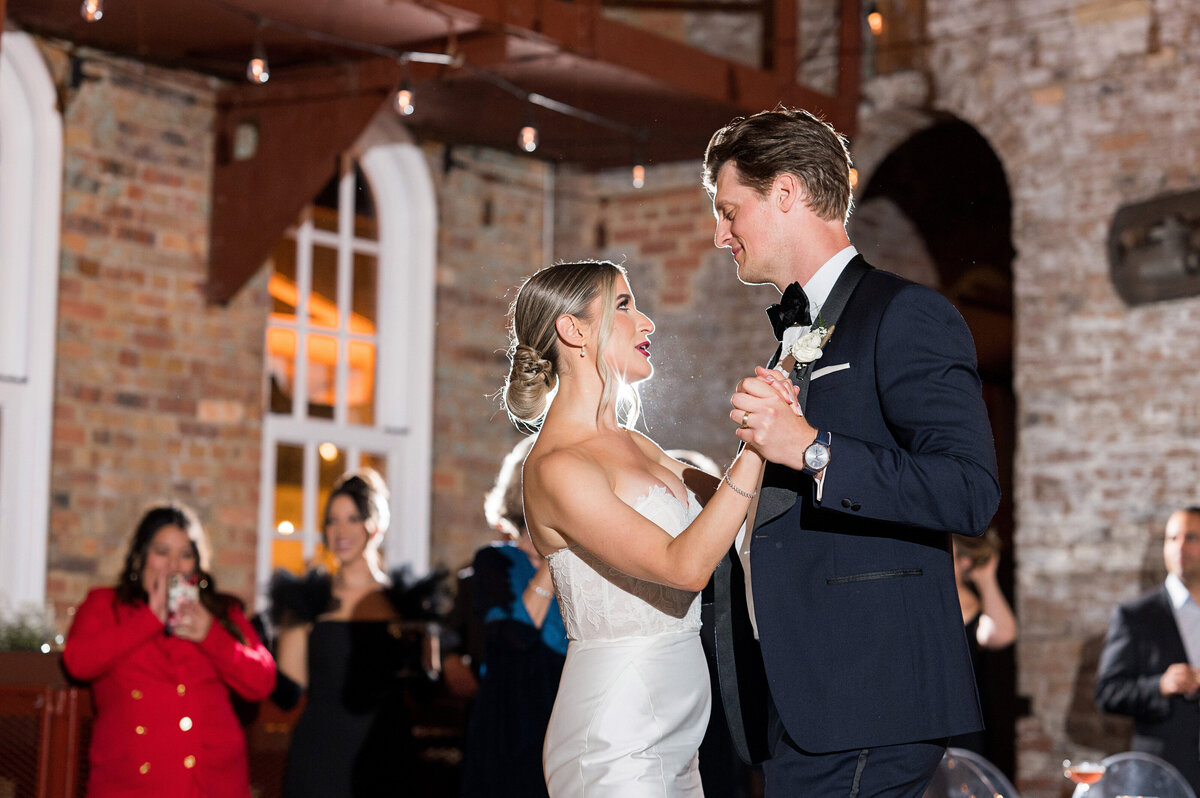 first dance photos bride and groom looking at eachother lovingly