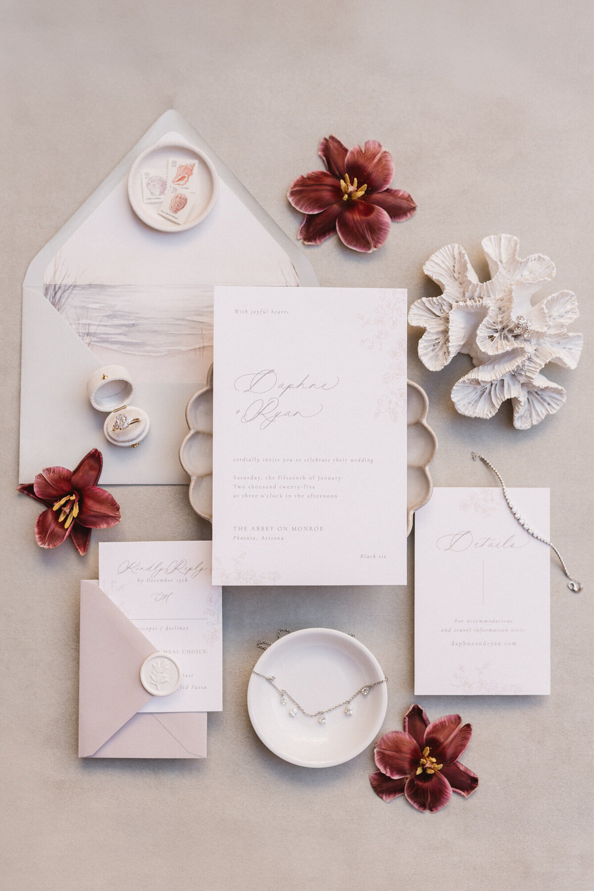 Flatlay details photo with invitation suite and flowers taken by wedding photographer in Phoenix