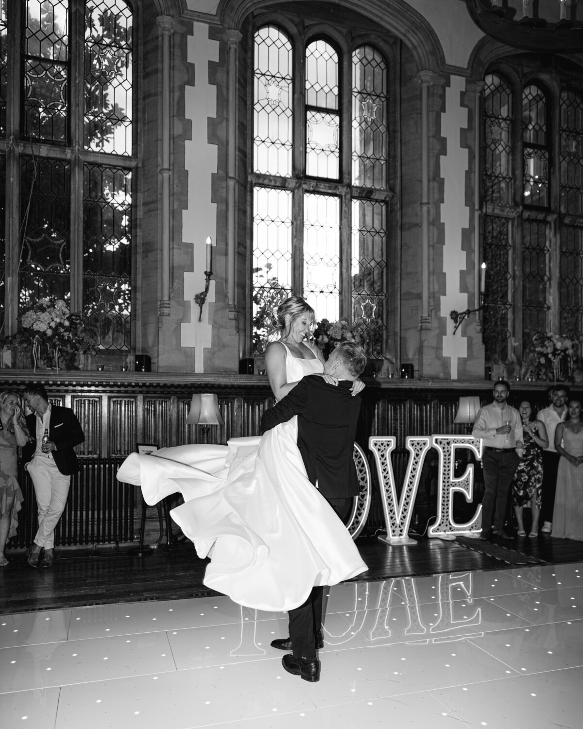 Bride and grooms first dance with lift