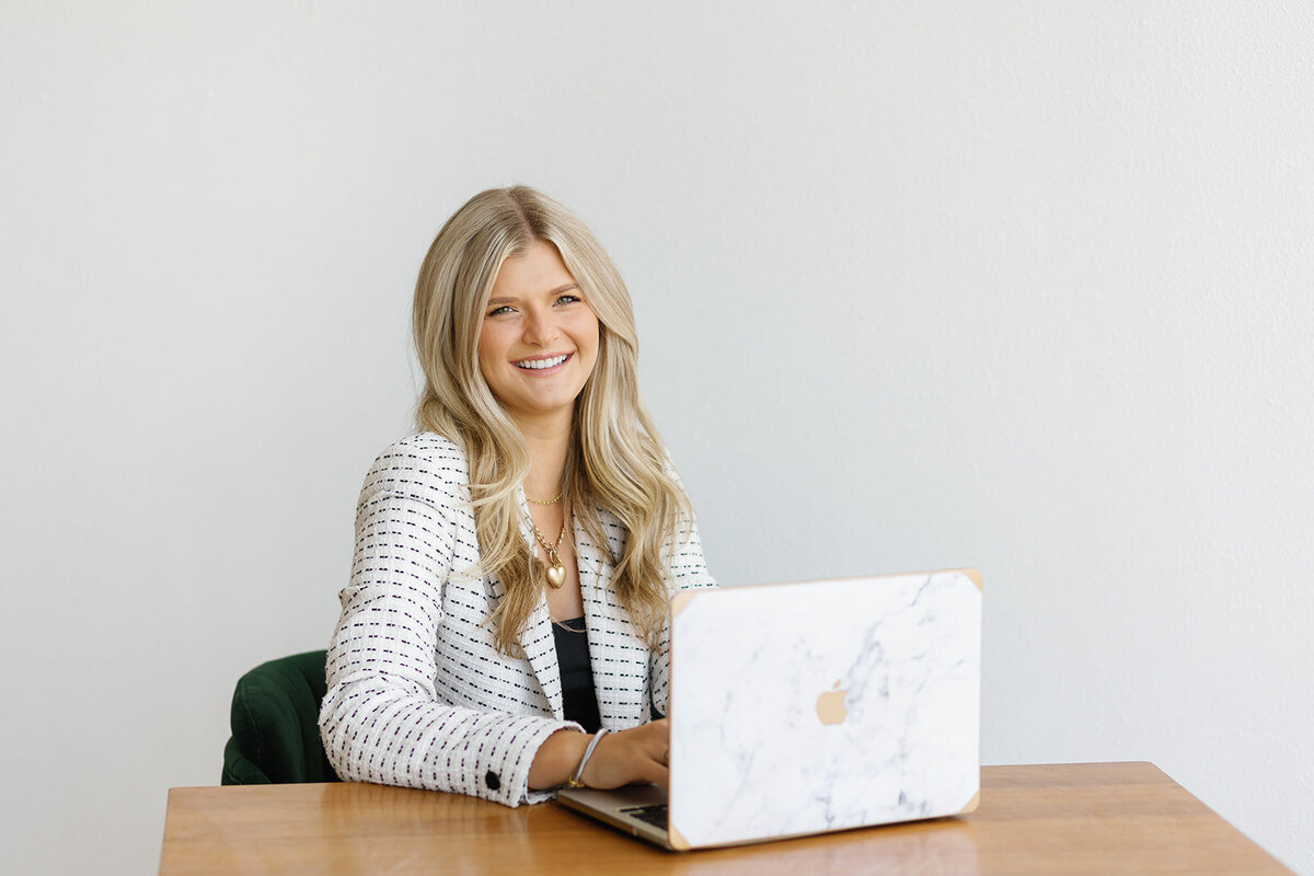 Modern lifestyle branding photo of content creator with laptop.