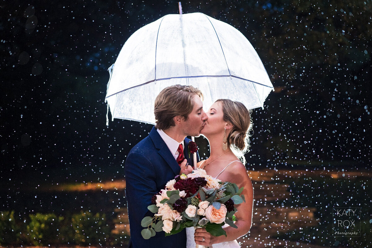 Wedding couple in the rain