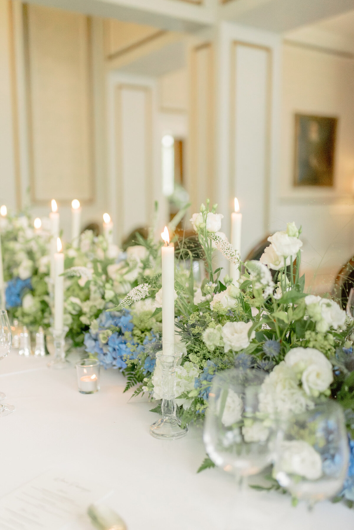 Taper candles and wedding flowers by Wild Burnett at Gleneagles on an intimate black tie wedding day. Image by luxury fine art wedding photographer, Jill Cherry Porter.