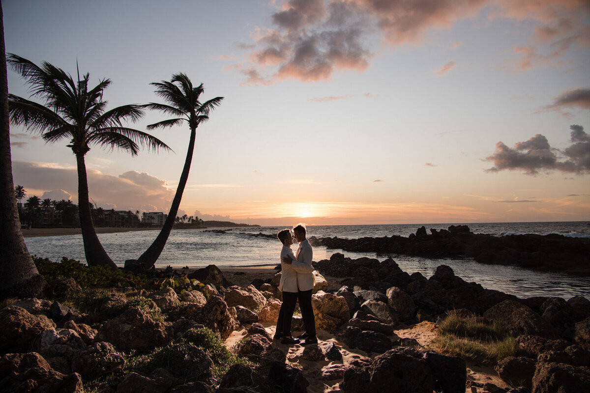 A couple poses at sunset  at a destination wedding in Puerto Rico