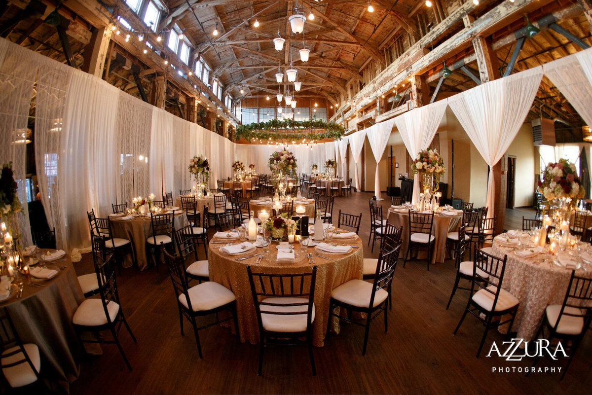 fall wedding reception at Sodo Park with draping, blush linens, and brown Chivari chairs