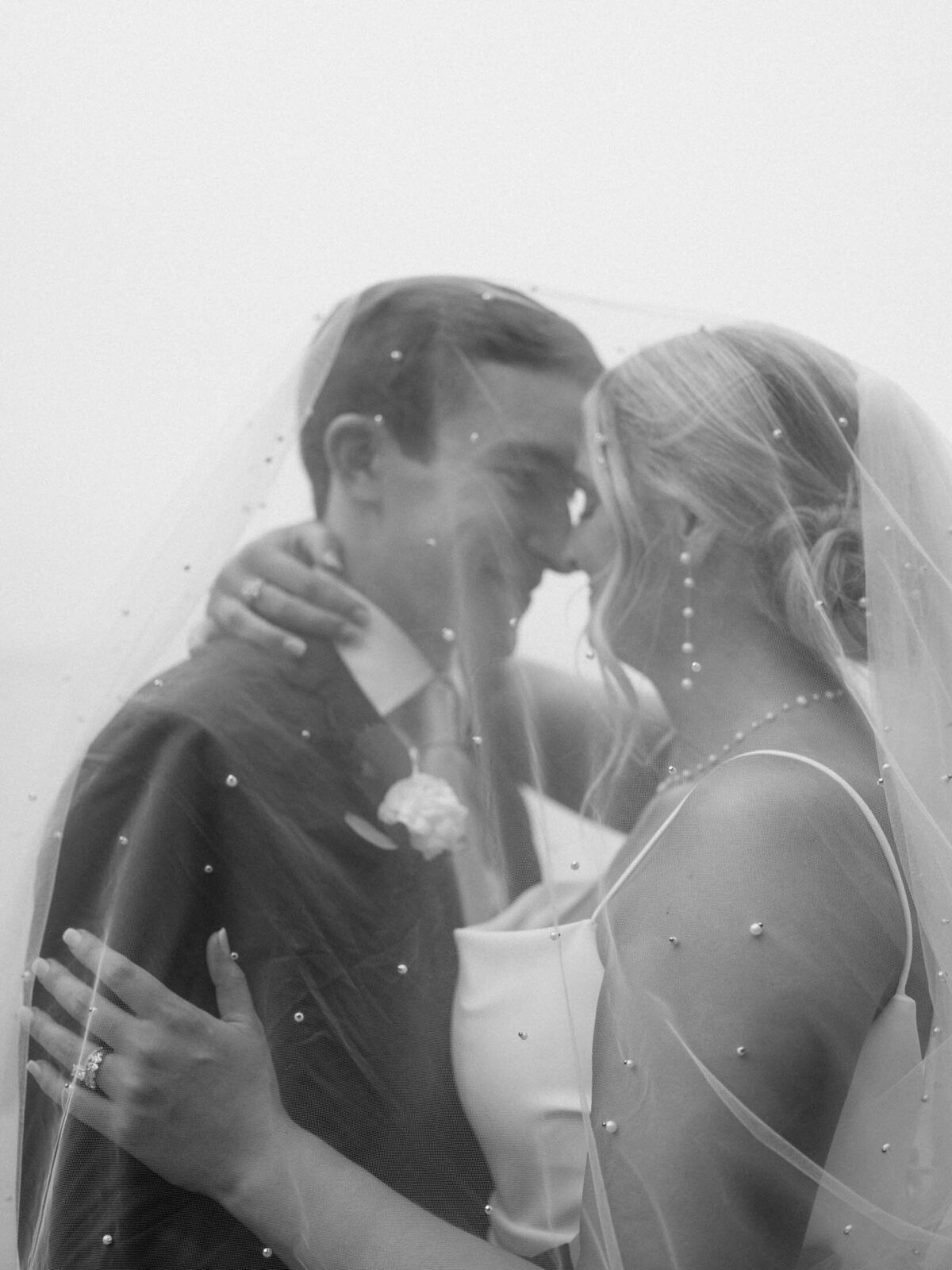 Bride and groom by the water at Cleveland Yachting Club
