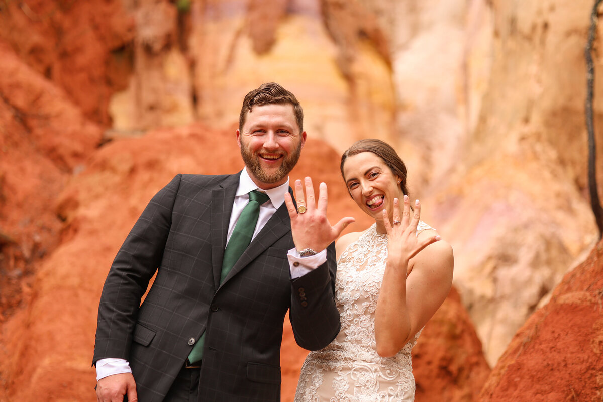 bride and groom showing off wedding rings after eloepement at Providence Canyon State Park by Columbus Georgia wedding photographer Amanda Richardson Photography