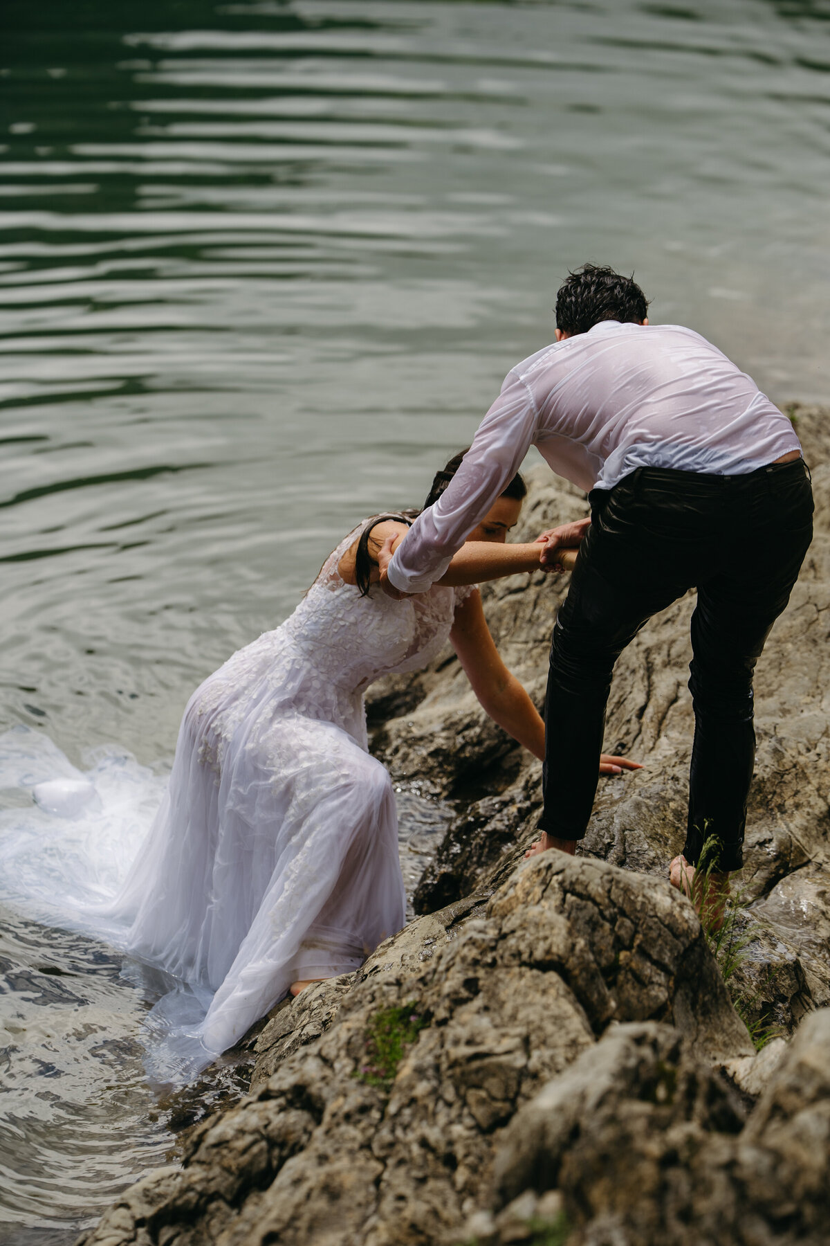 Eloped couple getting out of the water at Seealpsee