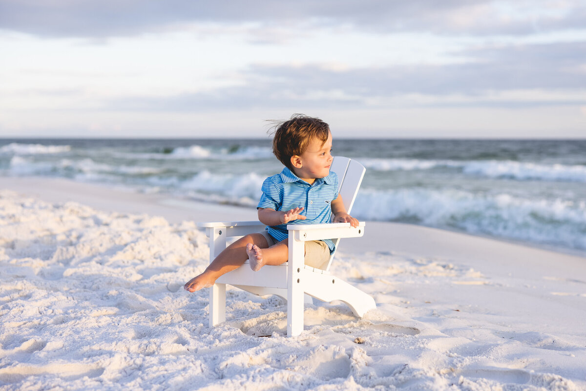 Beach portrait of toddler boy in chair