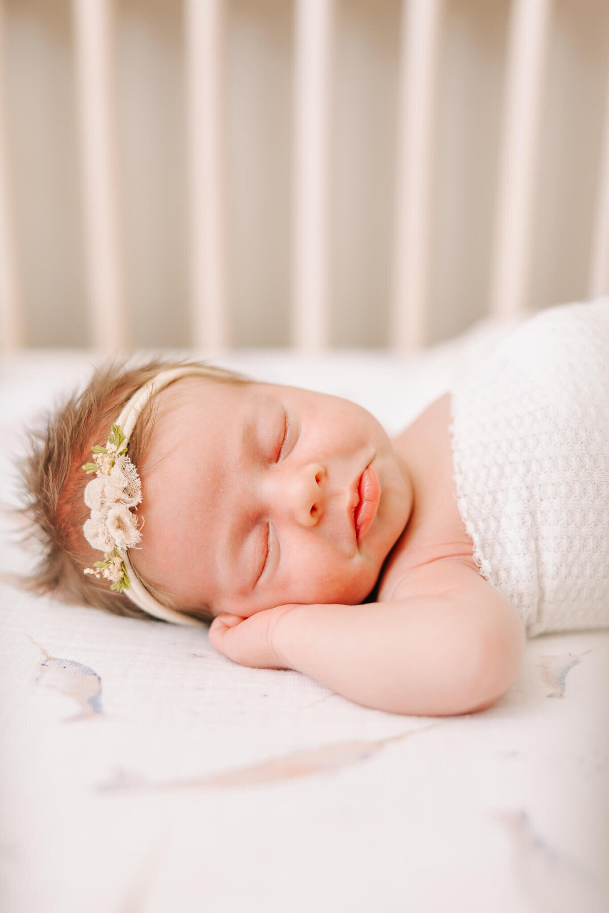 Newborn baby girl puckering her lips during her newborn session in their home in Waynesboro, GA