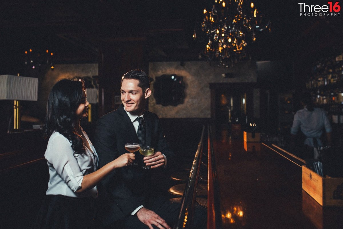 Engaged couple stop at an Old Pasadena bar for a glass of wine