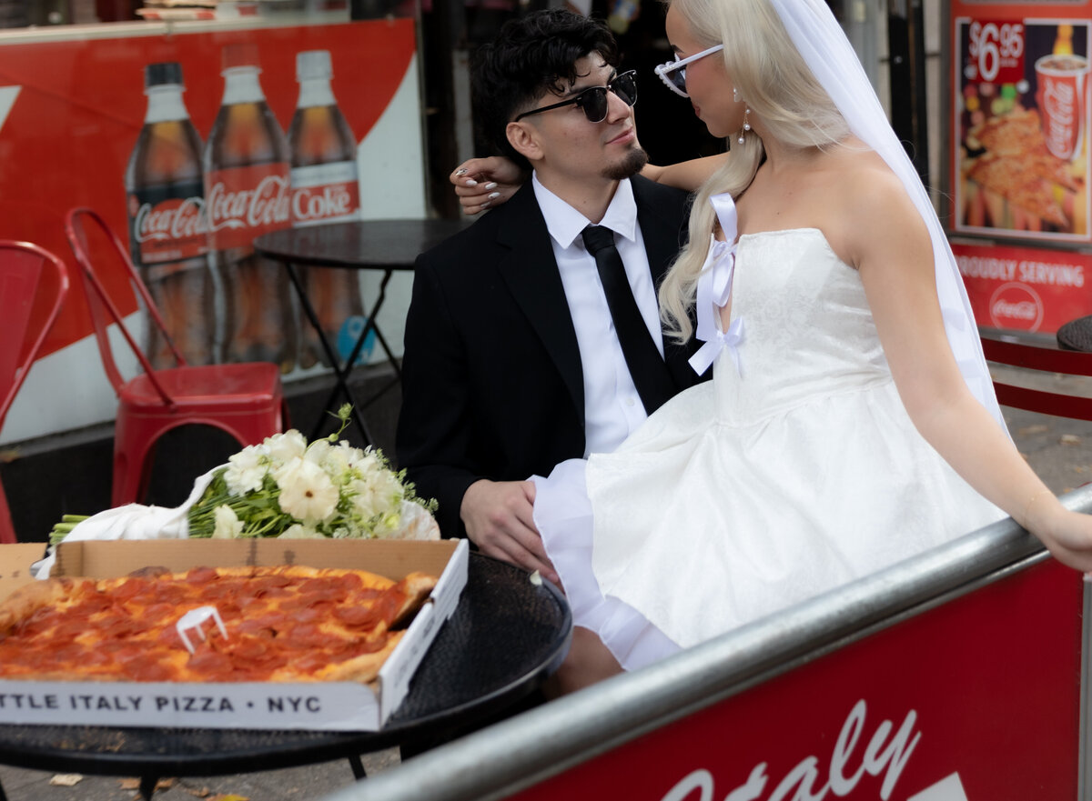 Close-up of a pizza slice with melted cheese during the couple’s NYC elopement pizza celebration.