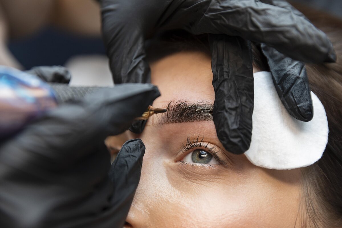 young-woman-getting-beauty-treatment-her-eyebrows