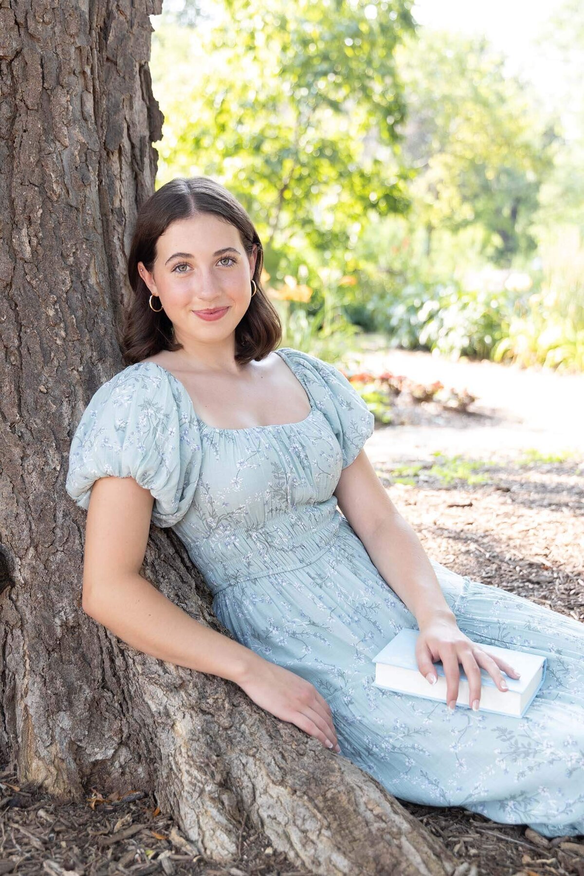 senior-garden-fairy-vibes-with-book
