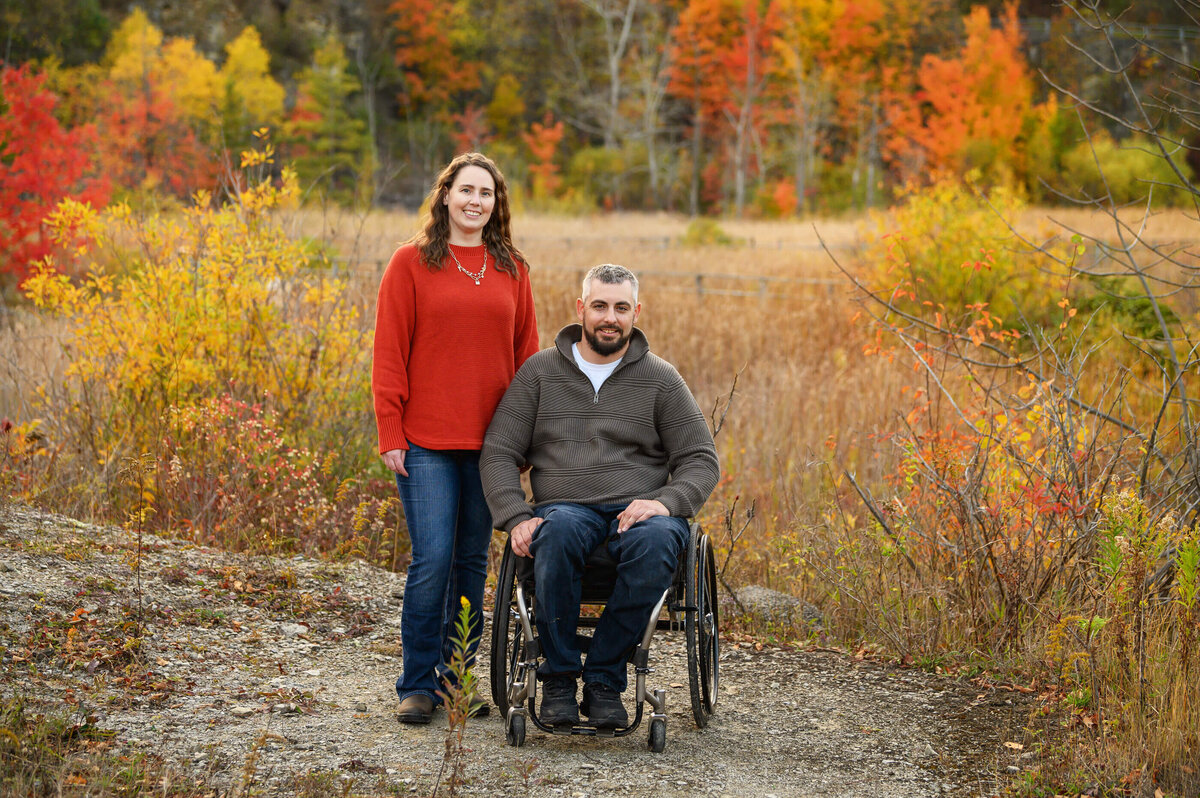 Husband and wife, husband in a wheelchair for their fall family photography session in Burlington, On