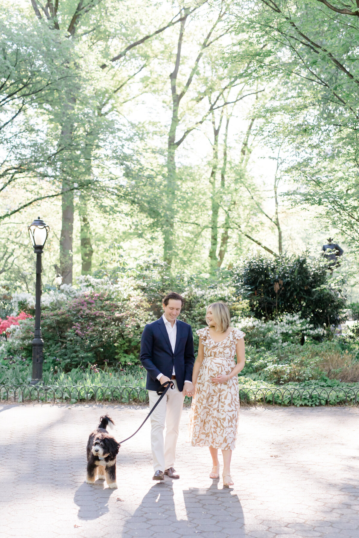 Manhattan Maternity session  couple walking with dog in the park