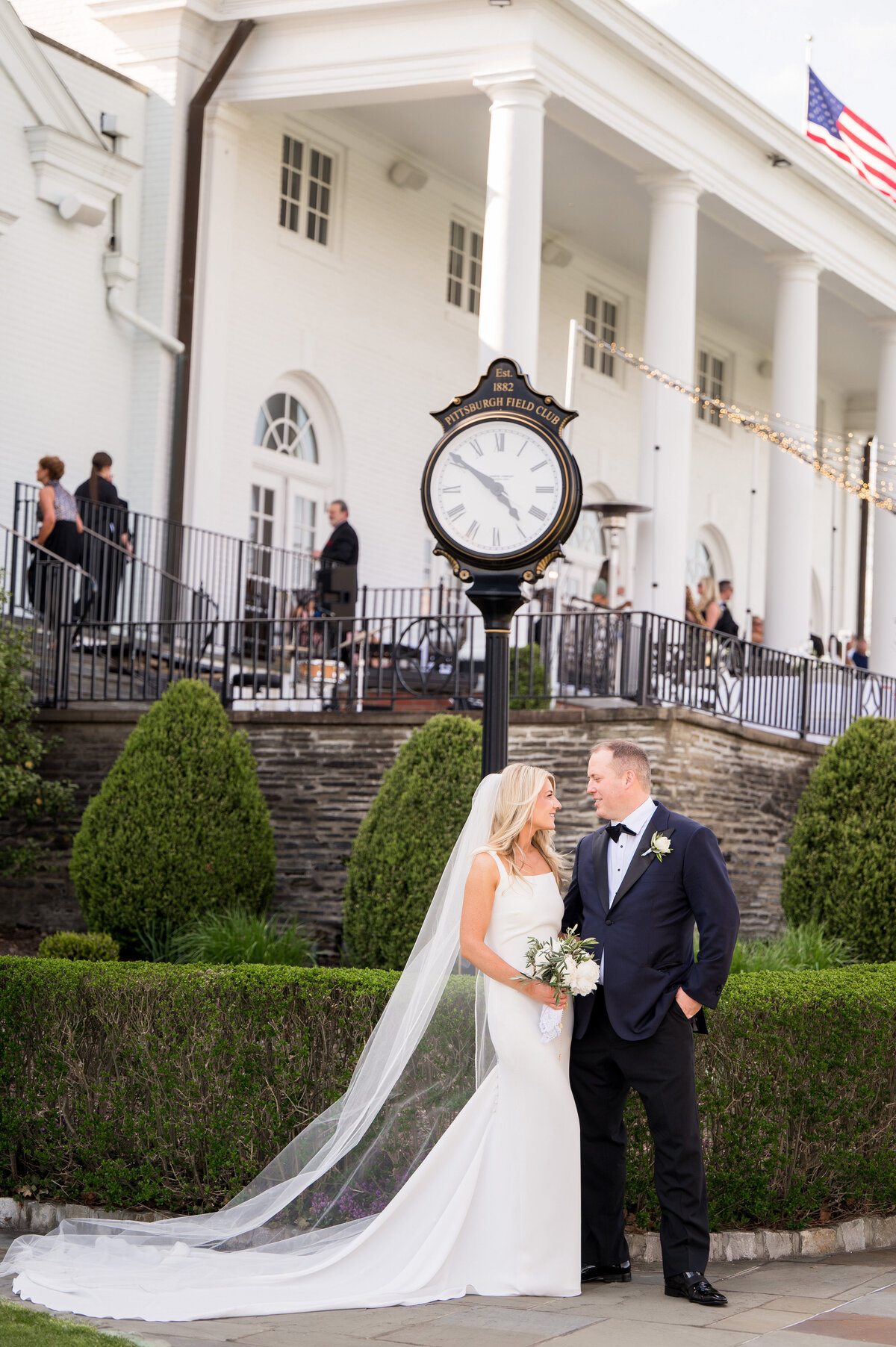 wedding couple with rolex clock at pittsburgh field club