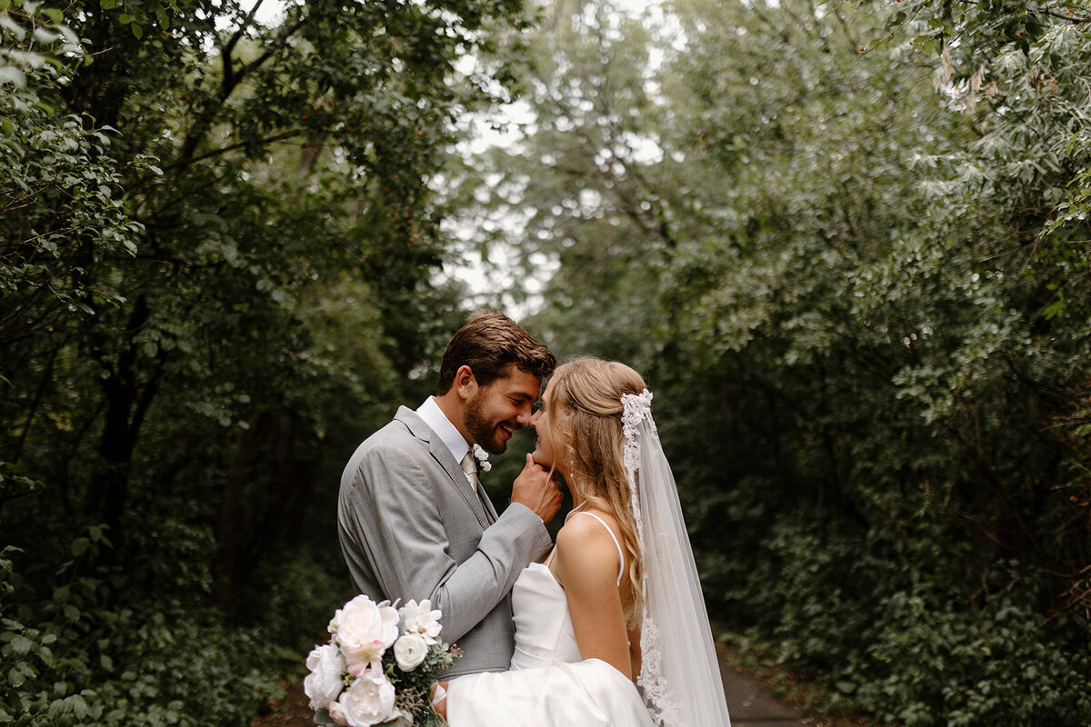 groom gazing lovingly at his bride