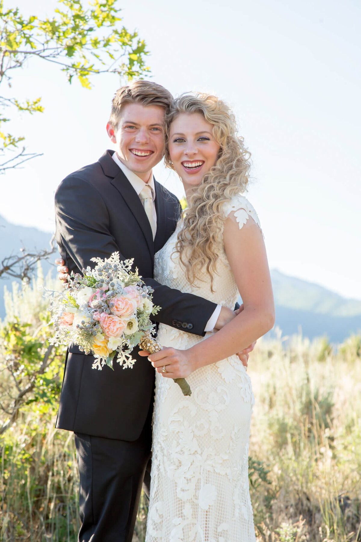 a wedding couple smiling