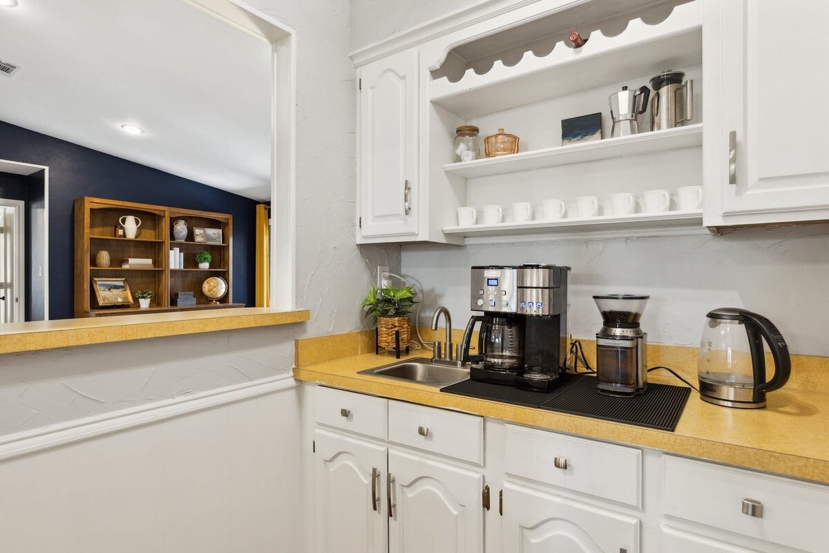 10216_shadow_way_dallas_tx_coffee_bar_-_built_in_white_cabinetry_with_open_shelving_and_vintage_countertops_-_haven_realty_group