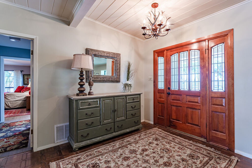 Entry way to this 5-bedroom, 4-bathroom vacation rental house for 16+ guests with pool, free wifi, guesthouse and game room just 20 minutes away from downtown Waco, TX.