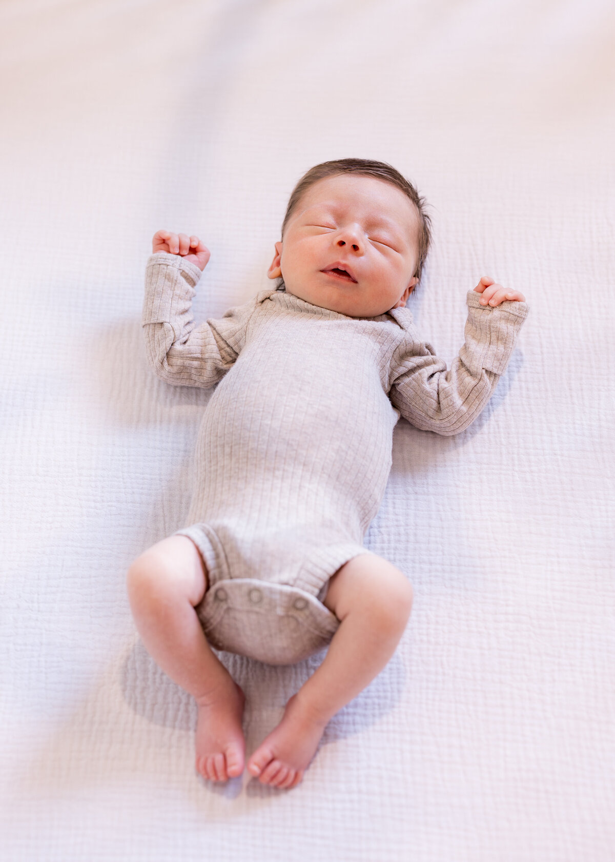 newborn photo in crib