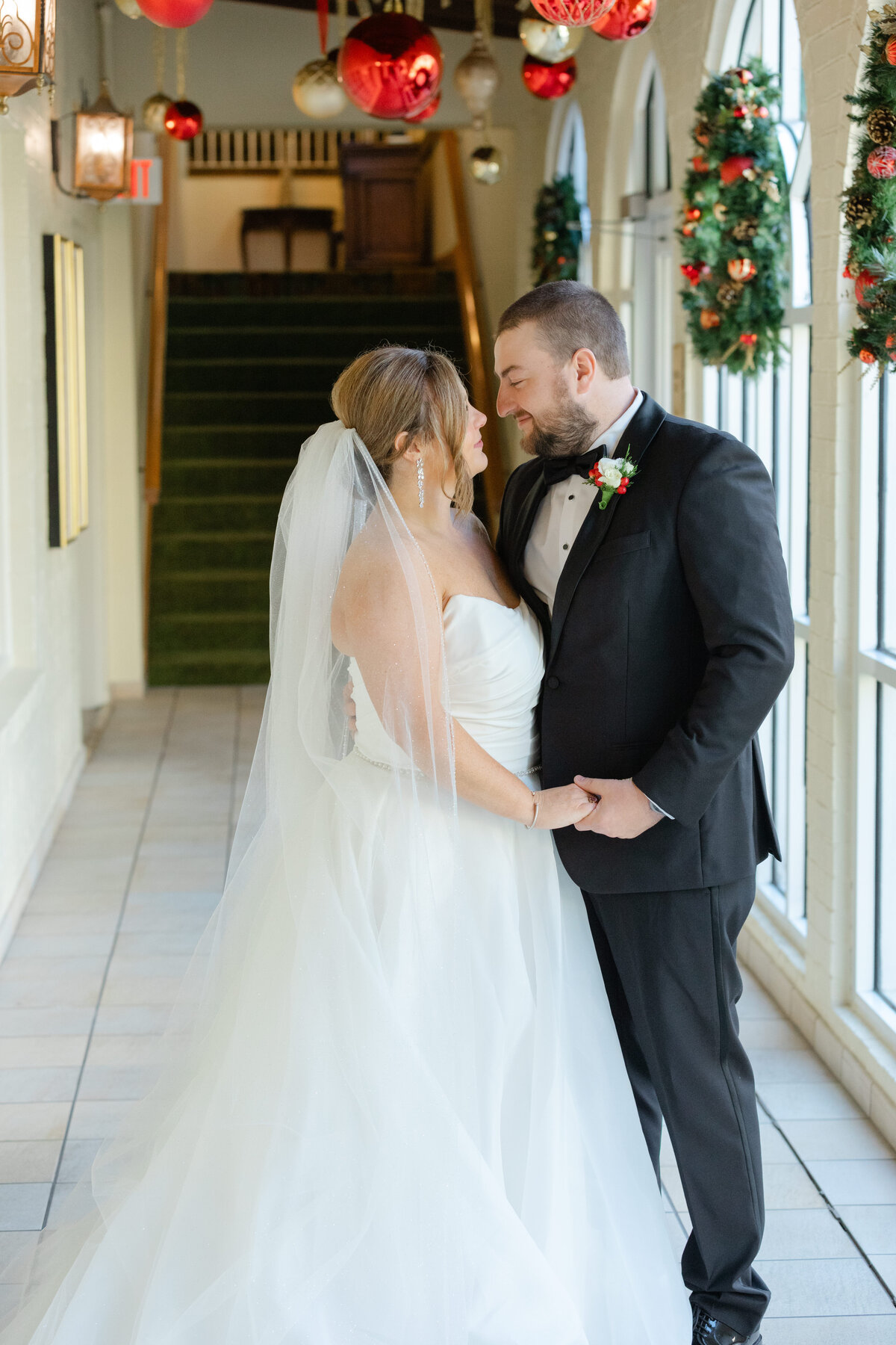 bride and groom about to kiss while sharing a private moment on their wedding day