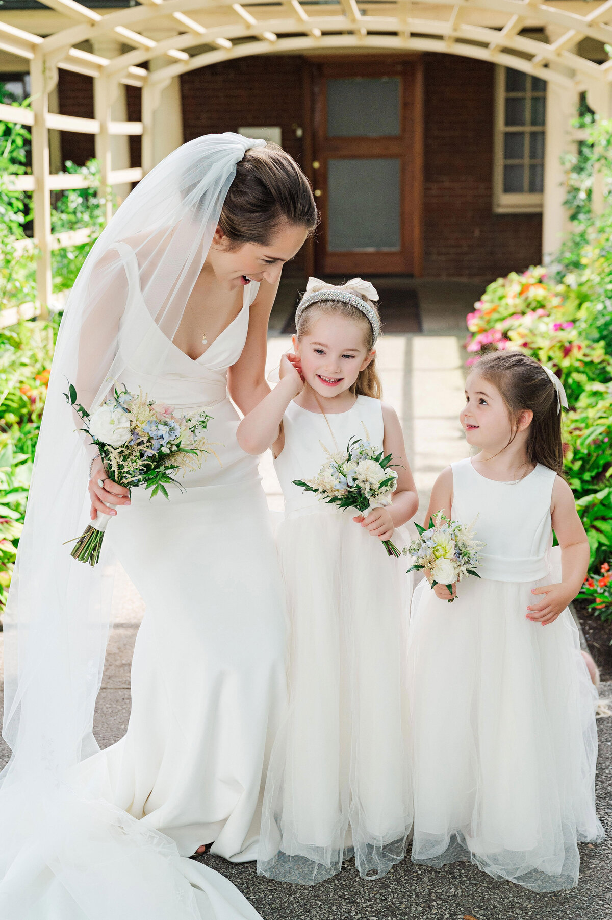bride and her flower girl nieces on wedding day at the frick
